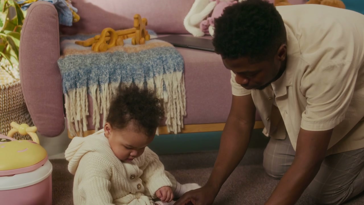 Father and Baby Playing with Toys at Home