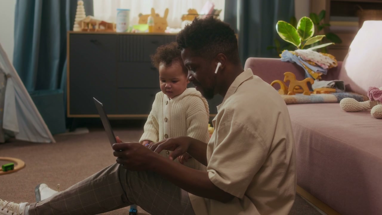 Dad Working From Home With Baby
