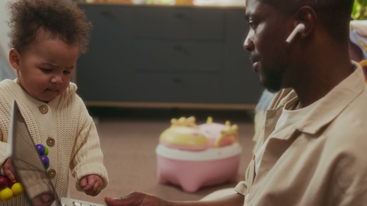 Father and Baby Playing by Laptop