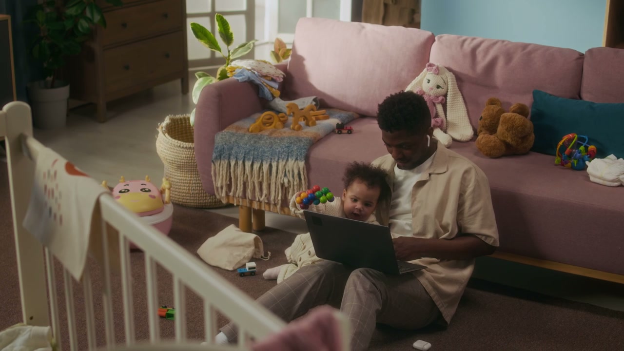 Working Dad and Baby at Home