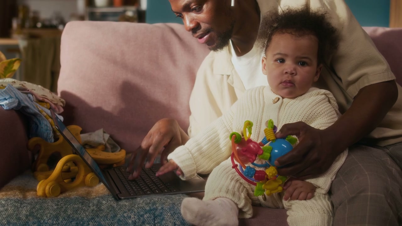 Father with Baby Working from Home