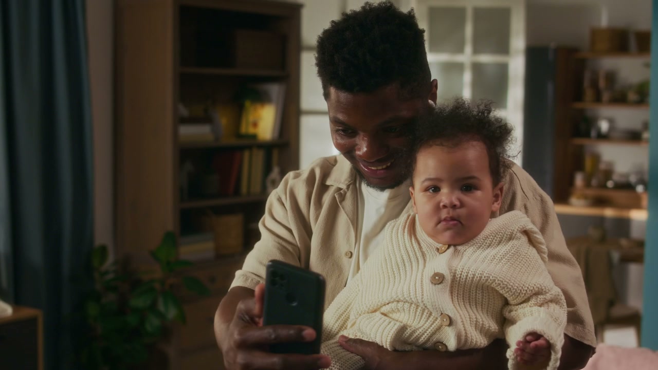 Father and Baby on Video Call at Home