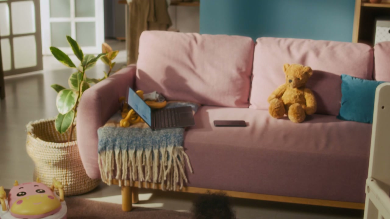 Father Picking Up Toys in Living Room