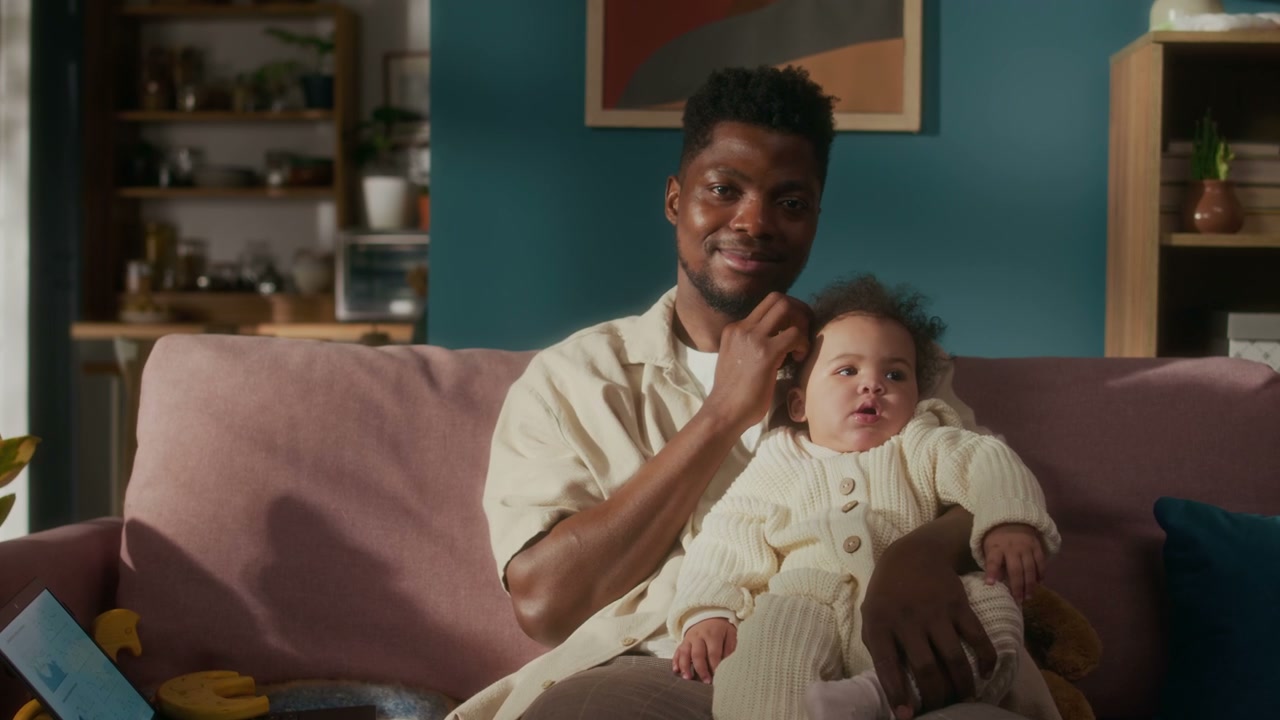 Happy Father Holding Baby Daughter