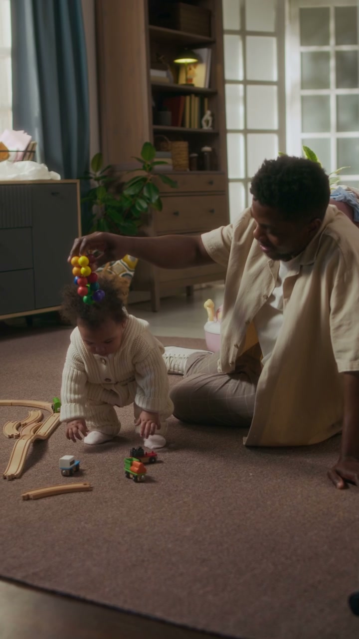 Father and Baby Playing on Floor
