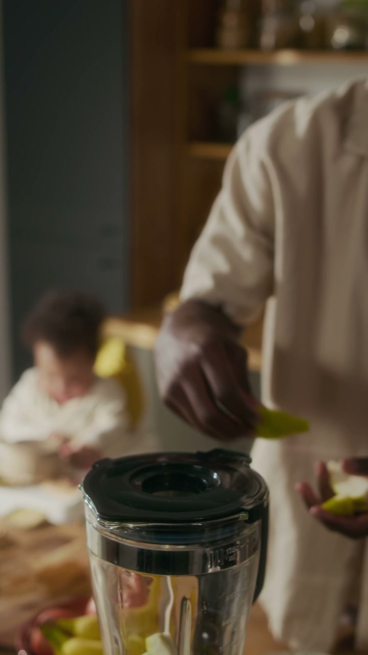 Dad Preparing Fruit Smoothie for Baby