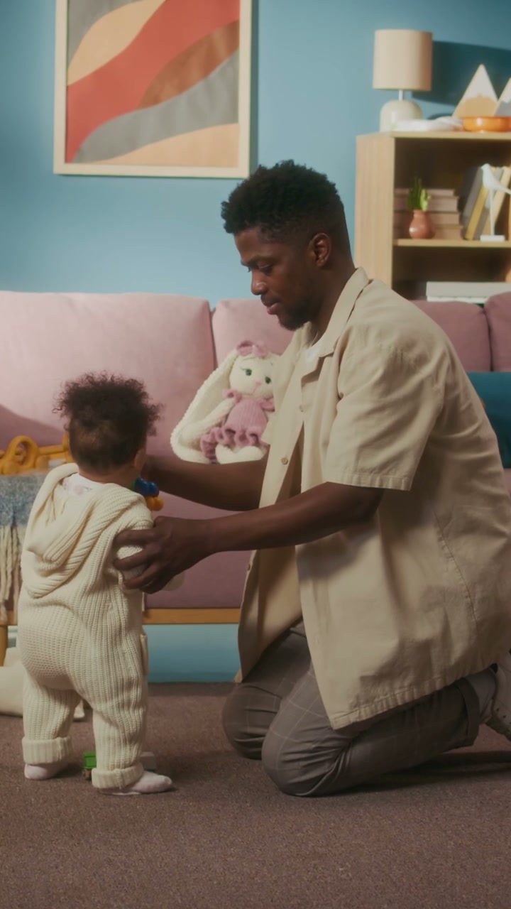 Dad Helps Baby Stand and Play