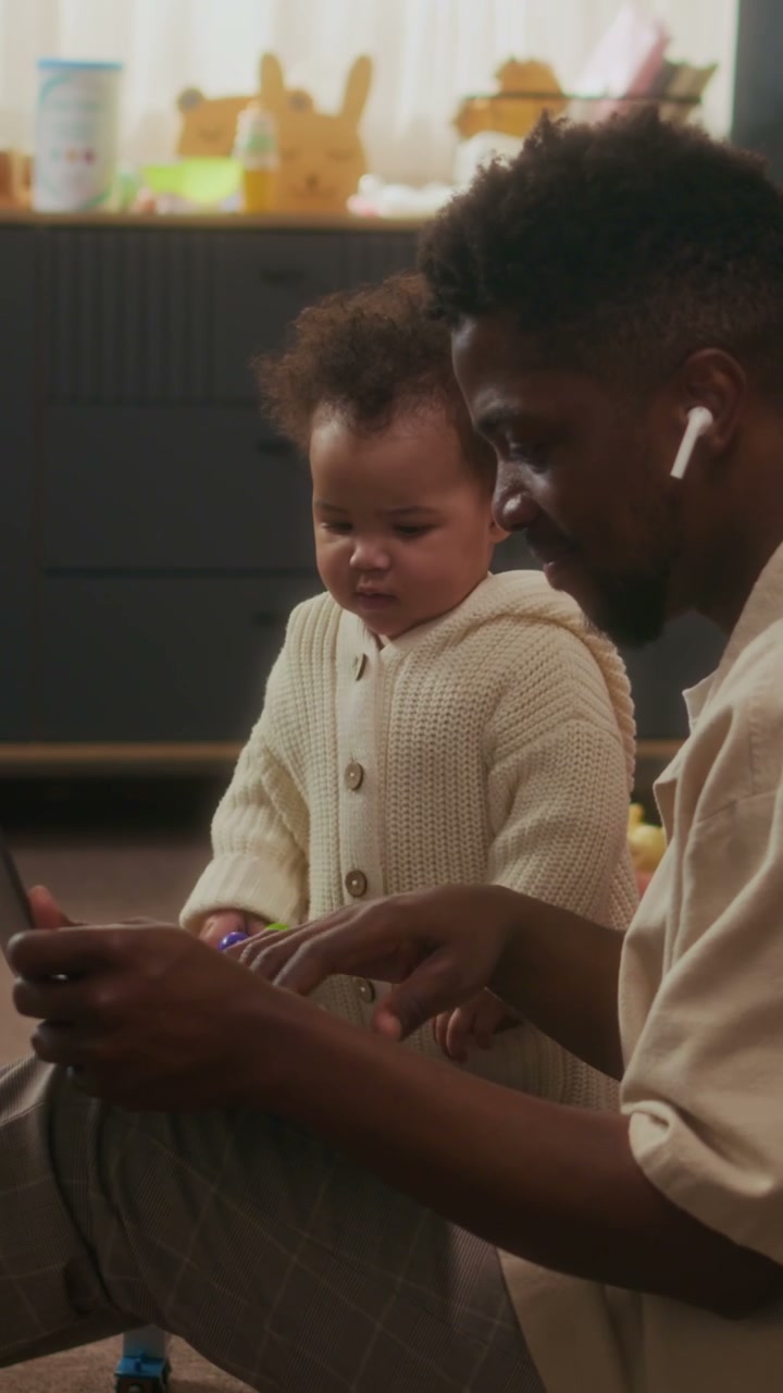 Dad Working on Laptop with Baby