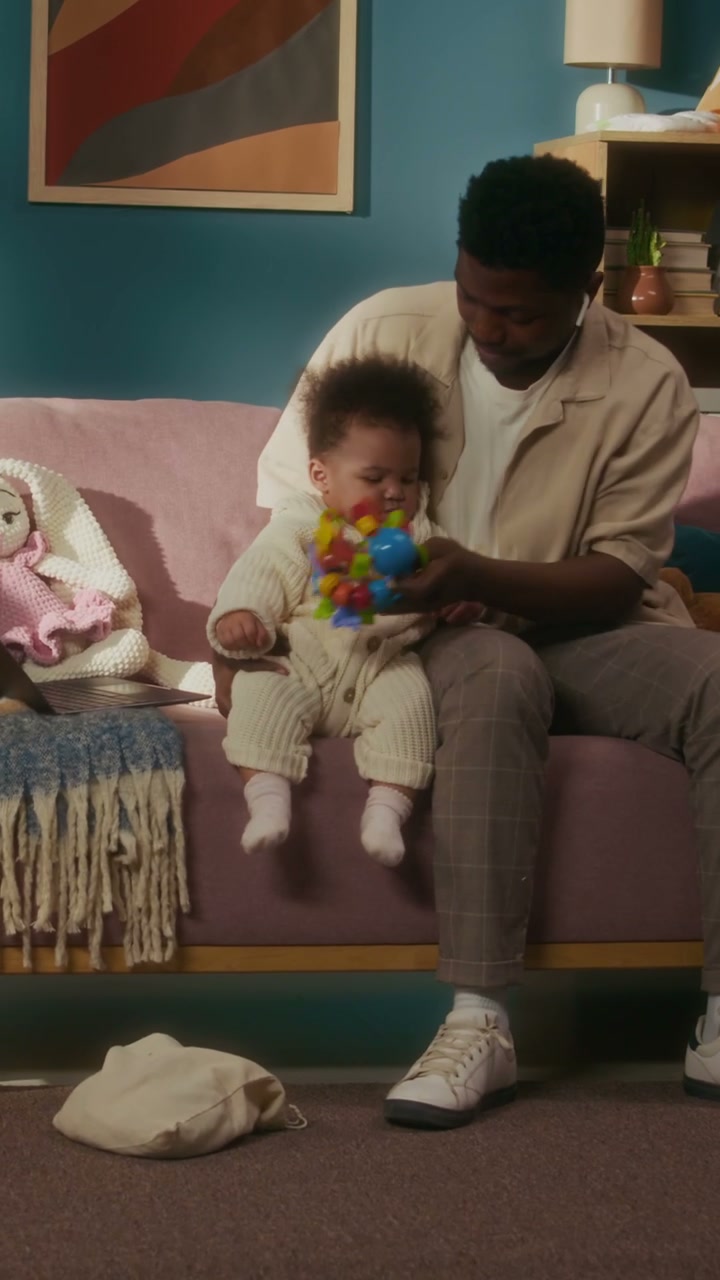 Father Playing with Baby and Toy