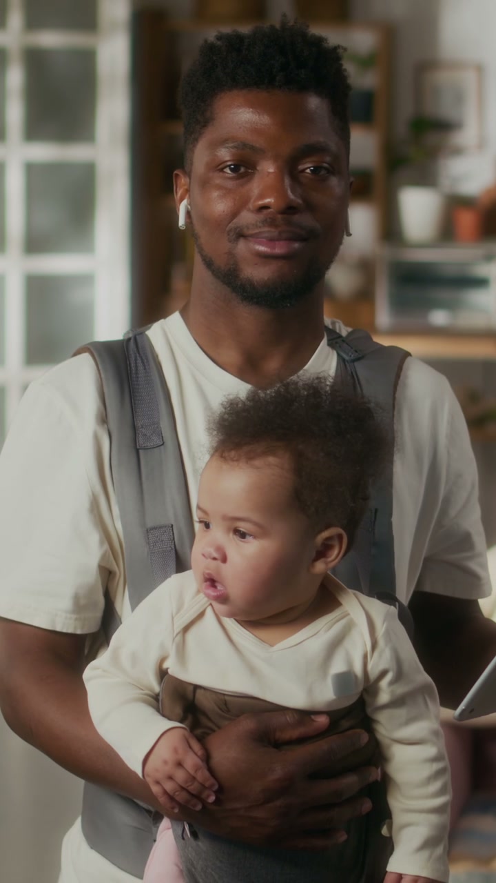 Father Carrying Baby in Carrier