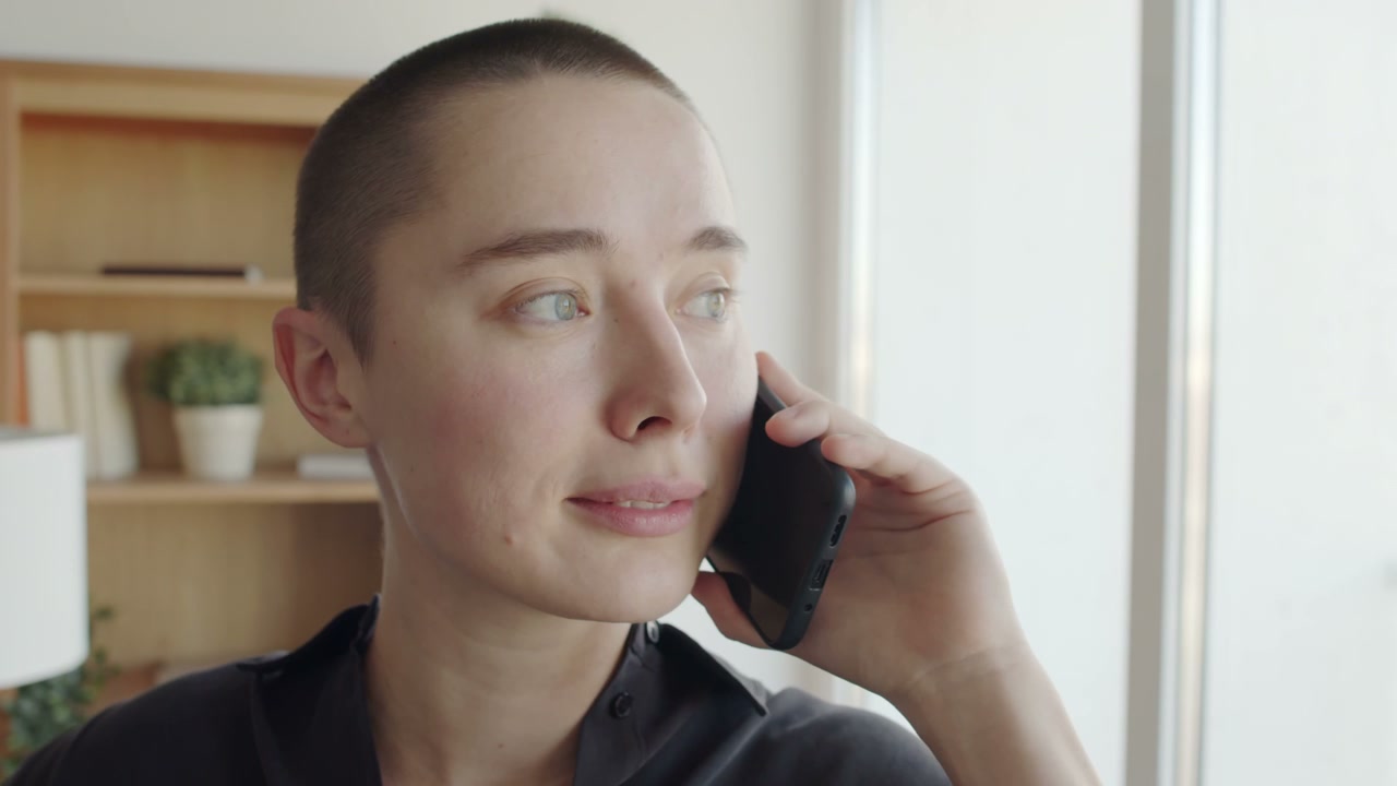 Person Talking on Phone in Co-working Office