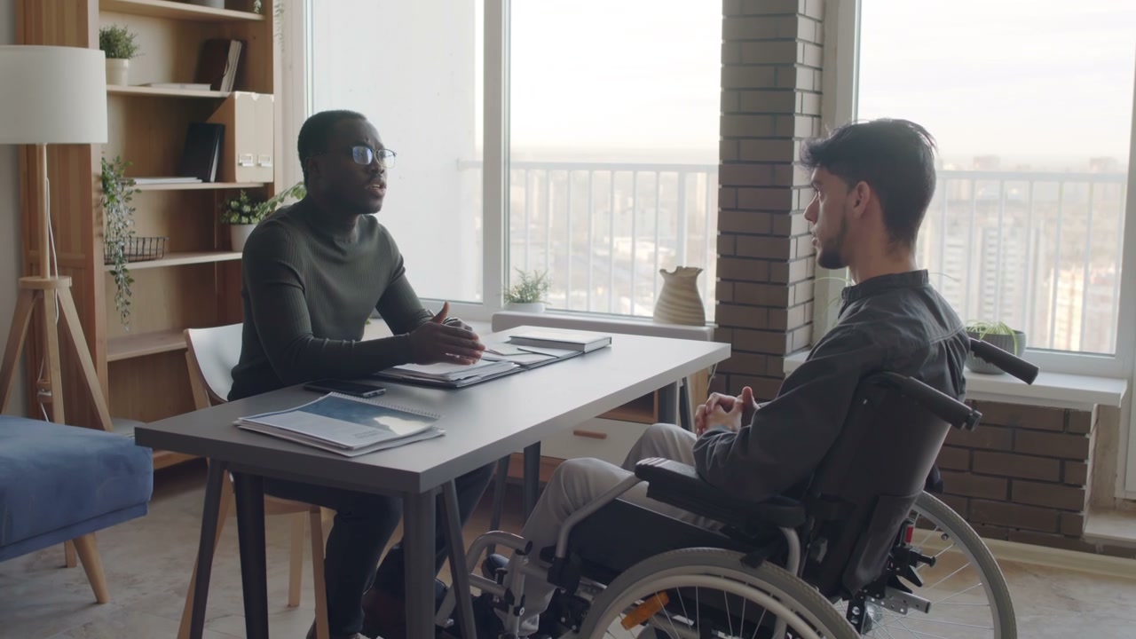 Business Conversation with Man in Wheelchair