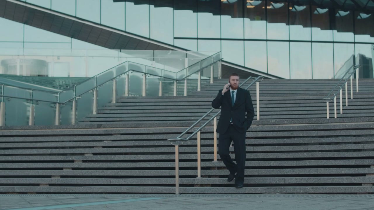 Professional Man Talking on Phone by Modern Building