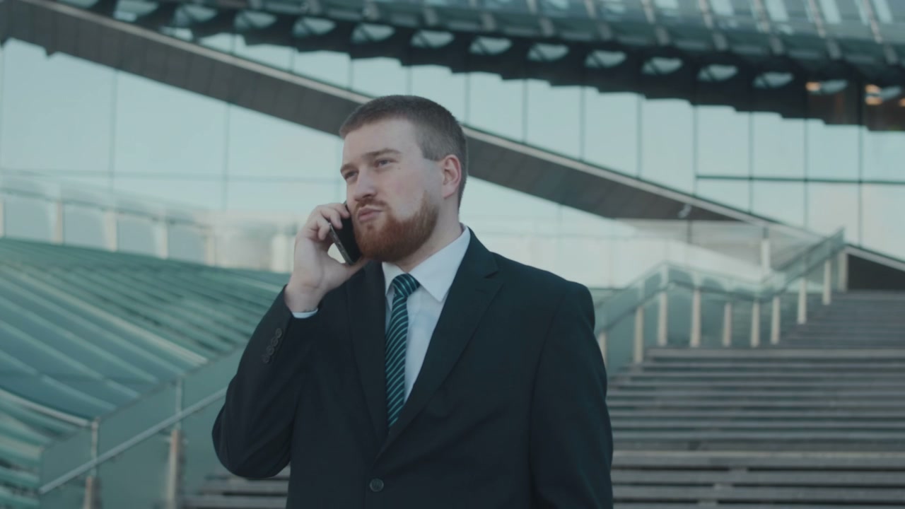 Businessman Talking on Smartphone by Lakhta Center
