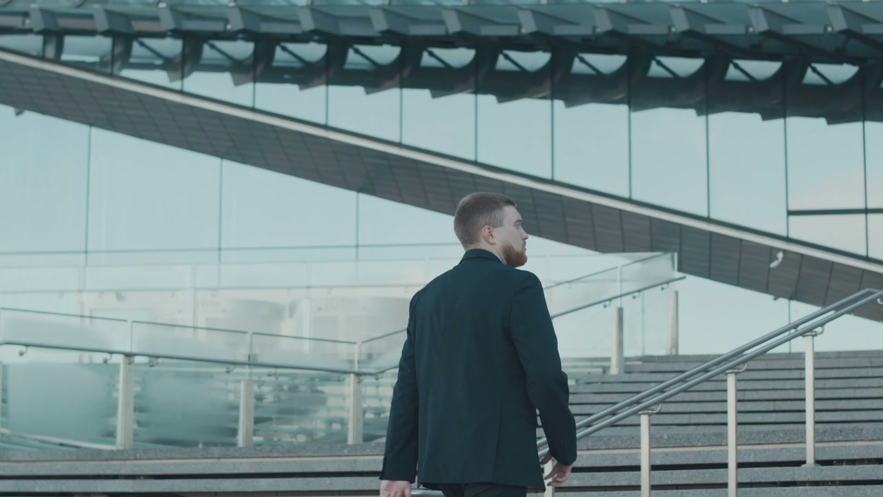 Businessman Ascending Modern Outdoor Stairs