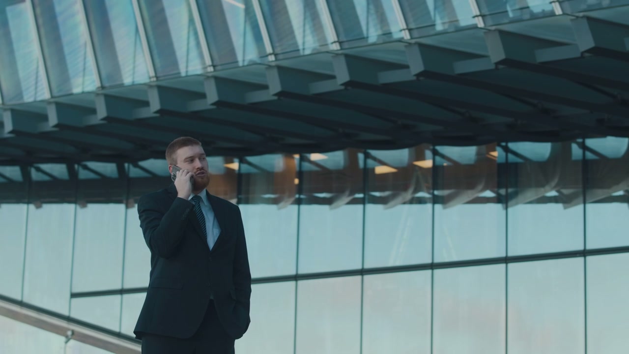 Businessman Talking on Phone in City