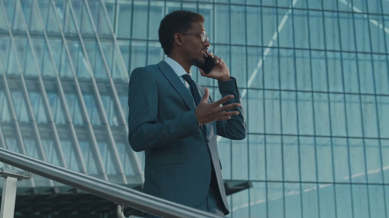 Businessman Talking on Phone in Business District