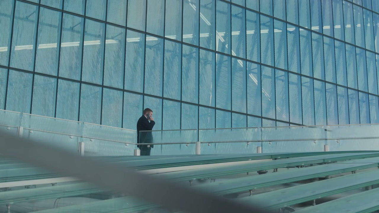 Businessman Talking on Phone in Modern City