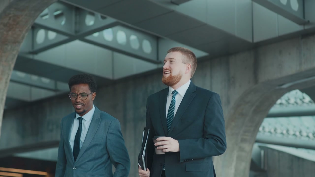 Businessmen Walking and Talking in Business District