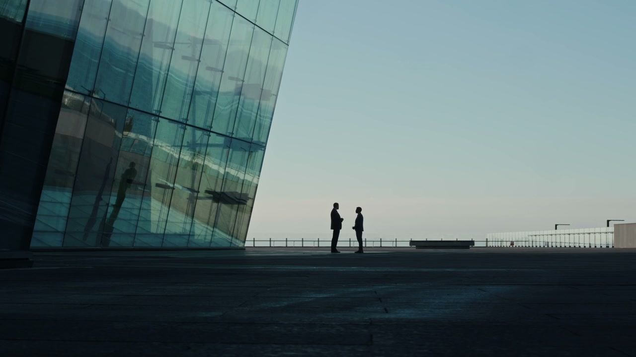 Business People Discussing Outside Skyscraper