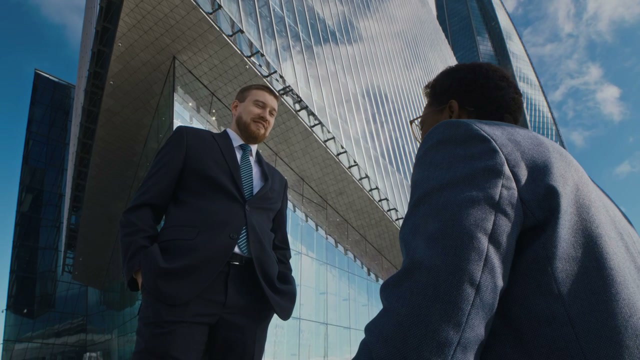 Businessmen Shaking Hands in Business District