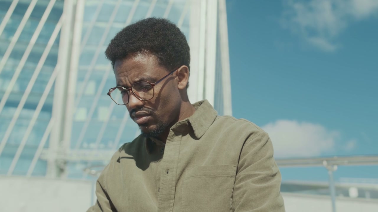 Focused Man Using Tablet Outdoors