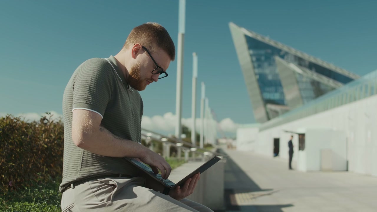 Young Man Working on Laptop at Lakhta Center