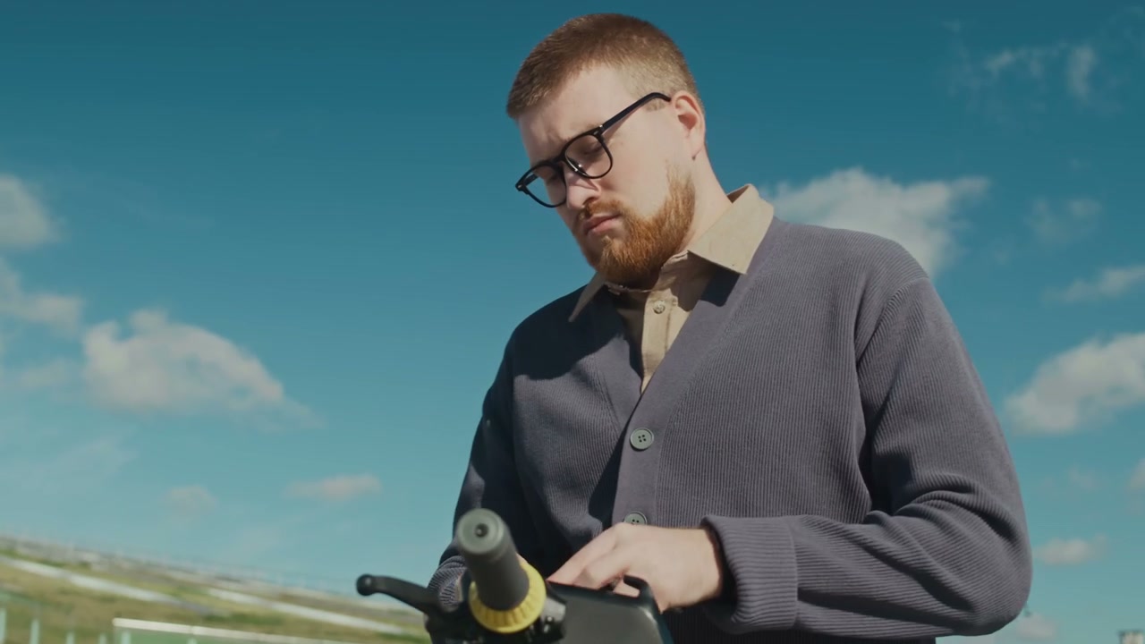 Man Activating Electric Scooter Outdoors