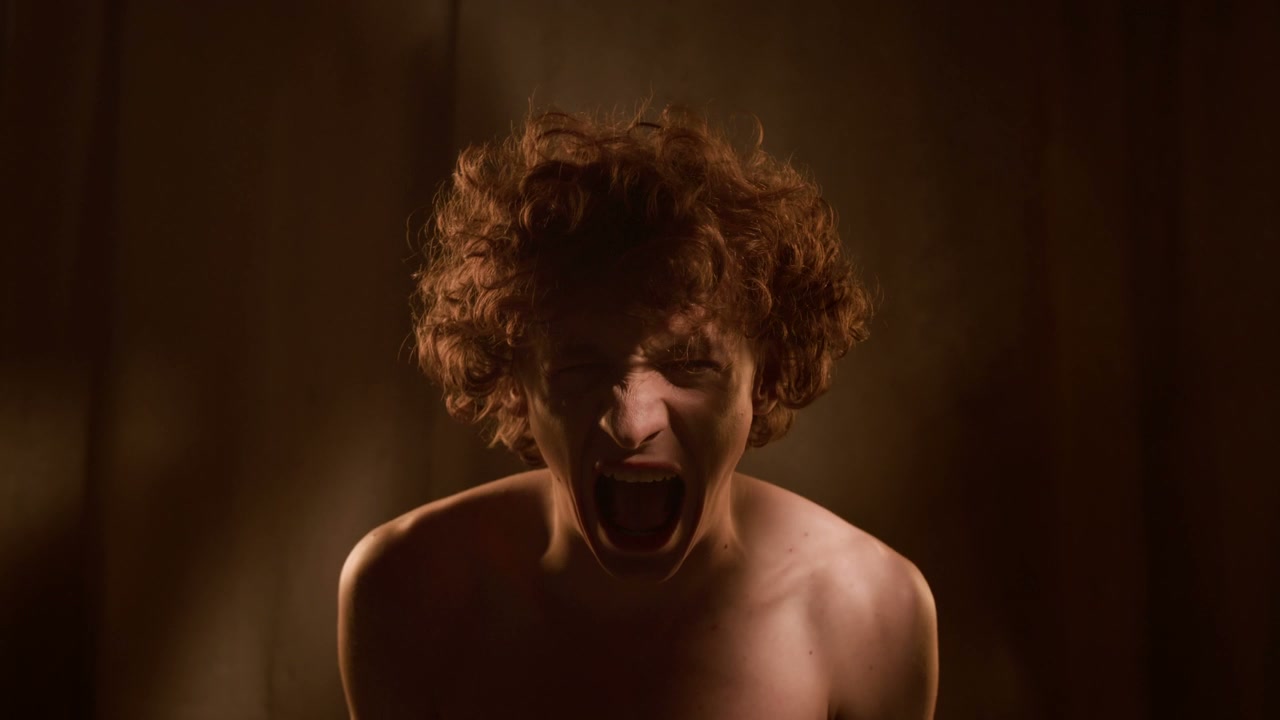 Young Man Screaming in Despair