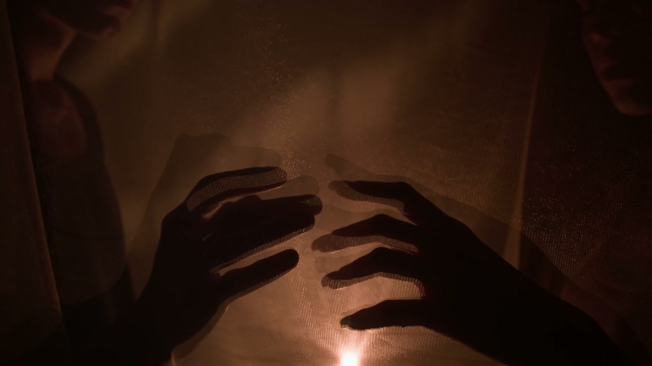 Silhouetted Hands Expressing Tenderness