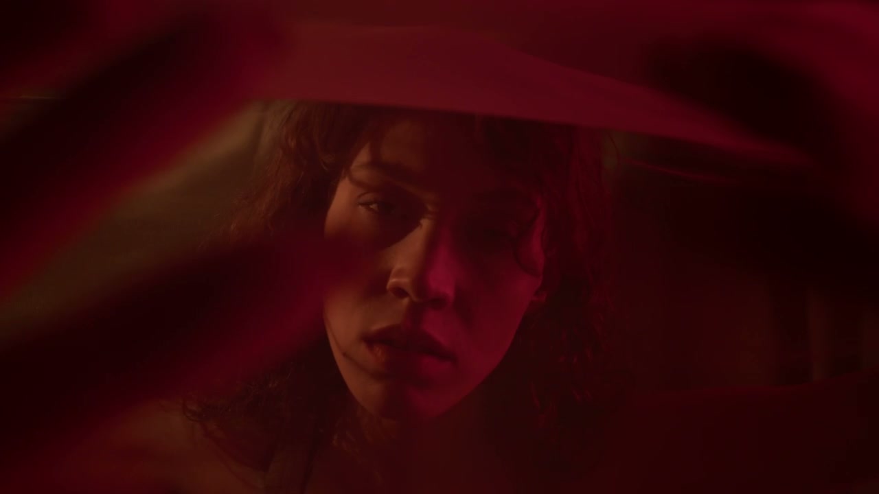 Woman Behind Sheer Fabric in Red Light