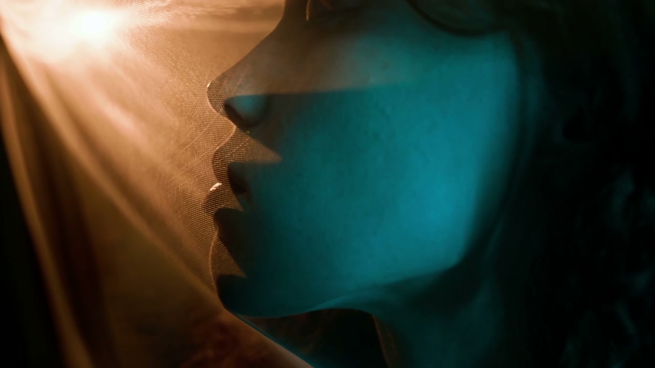 Moody Close-Up of Person Behind Sheer Fabric
