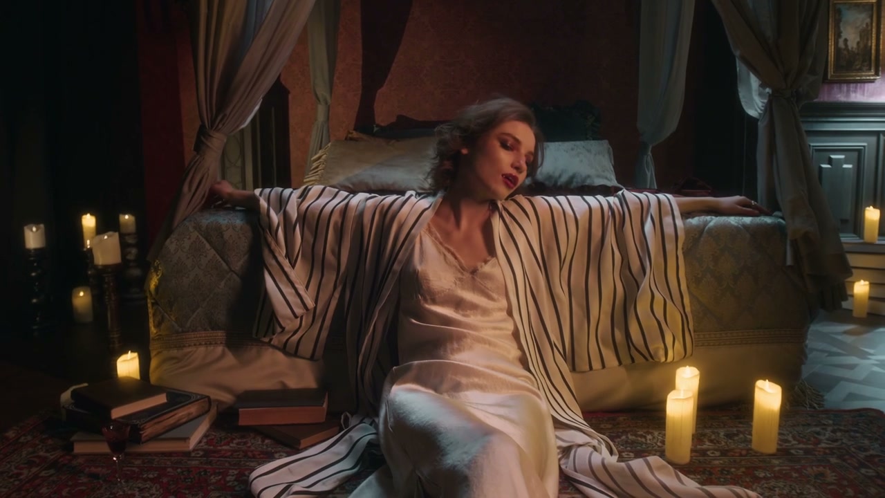 Seductive Woman in Candlelit Gothic Bedroom