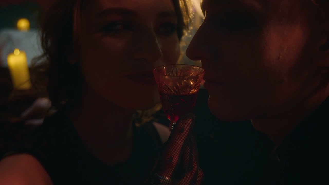 Vampire Couple Sharing a Red Drink