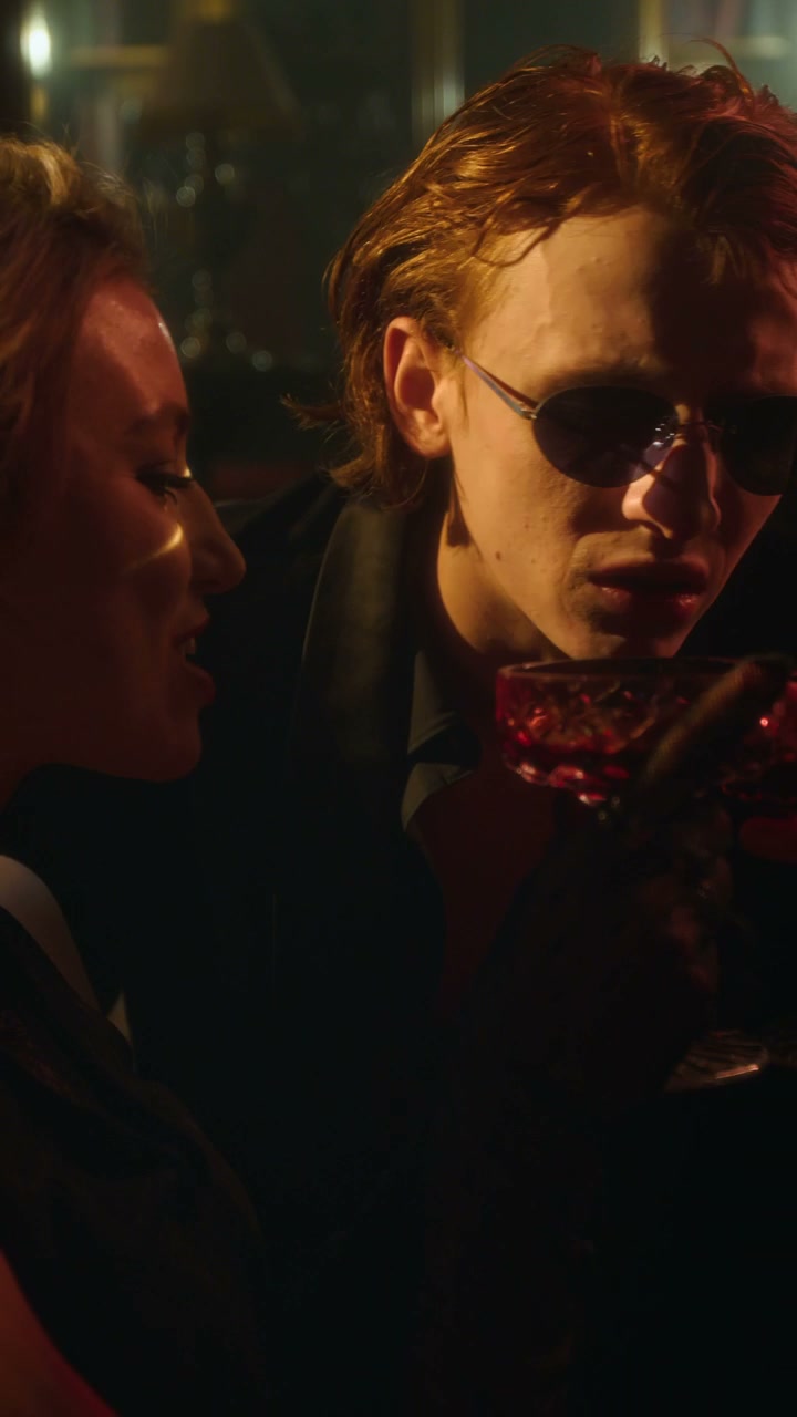 Dramatic Vampire Couple Drinking Cocktails