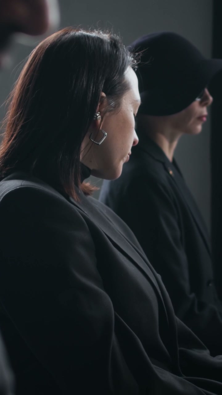 Woman Grieving at a Funeral Service
