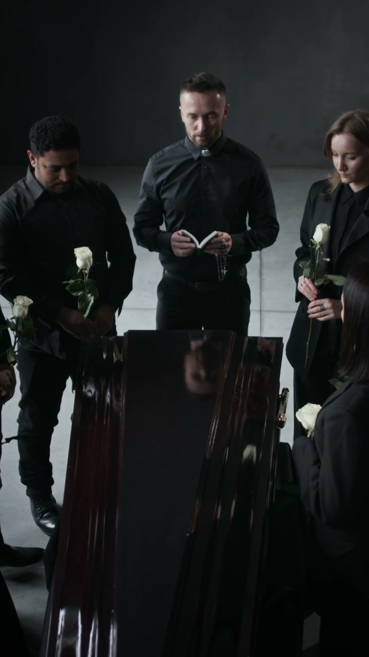 Mourners at Funeral Service with Coffin