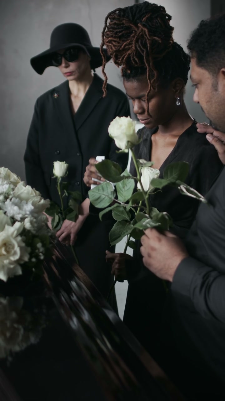 Mourners Attending a Funeral Service