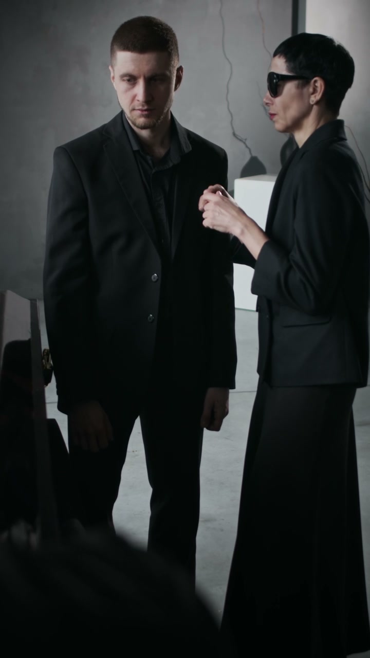 Mourners Comforting Each Other at Funeral