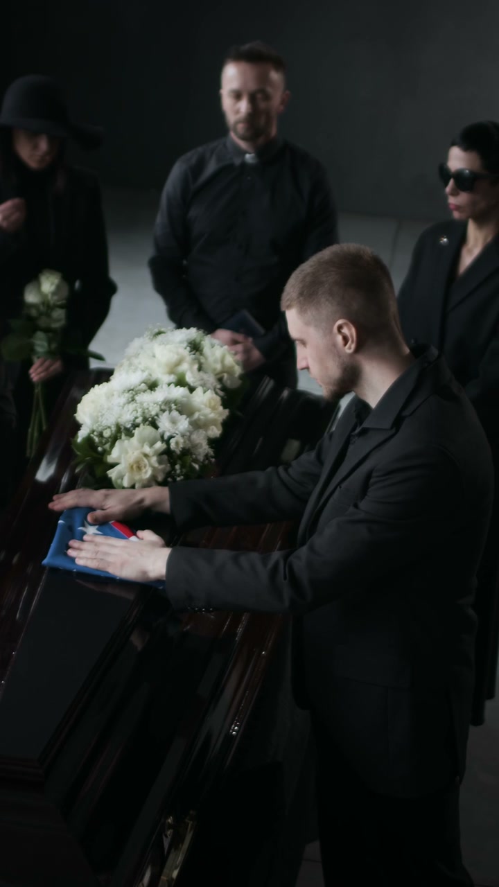Man Grieving at Military Funeral Service