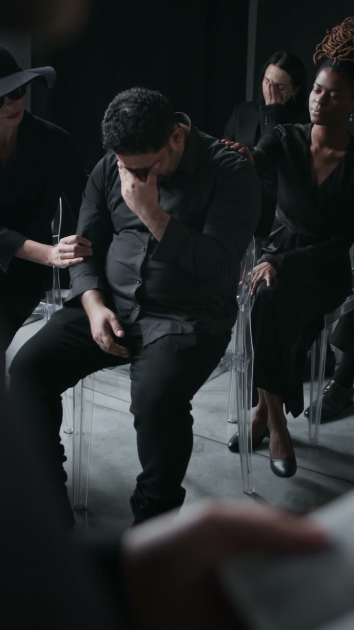 Grieving Man at Funeral Service