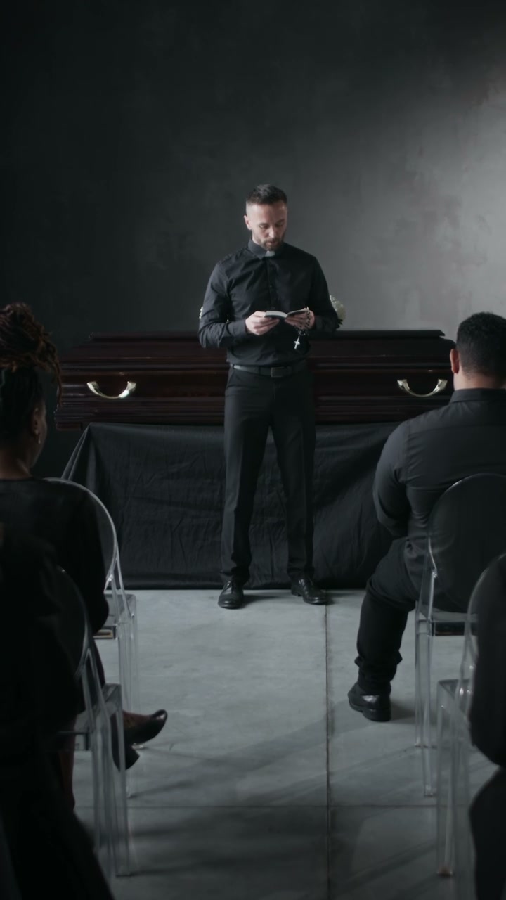 Priest Leading Funeral Service
