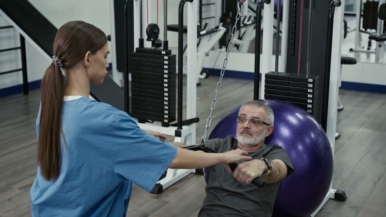 Senior Man Exercising with Physiotherapist