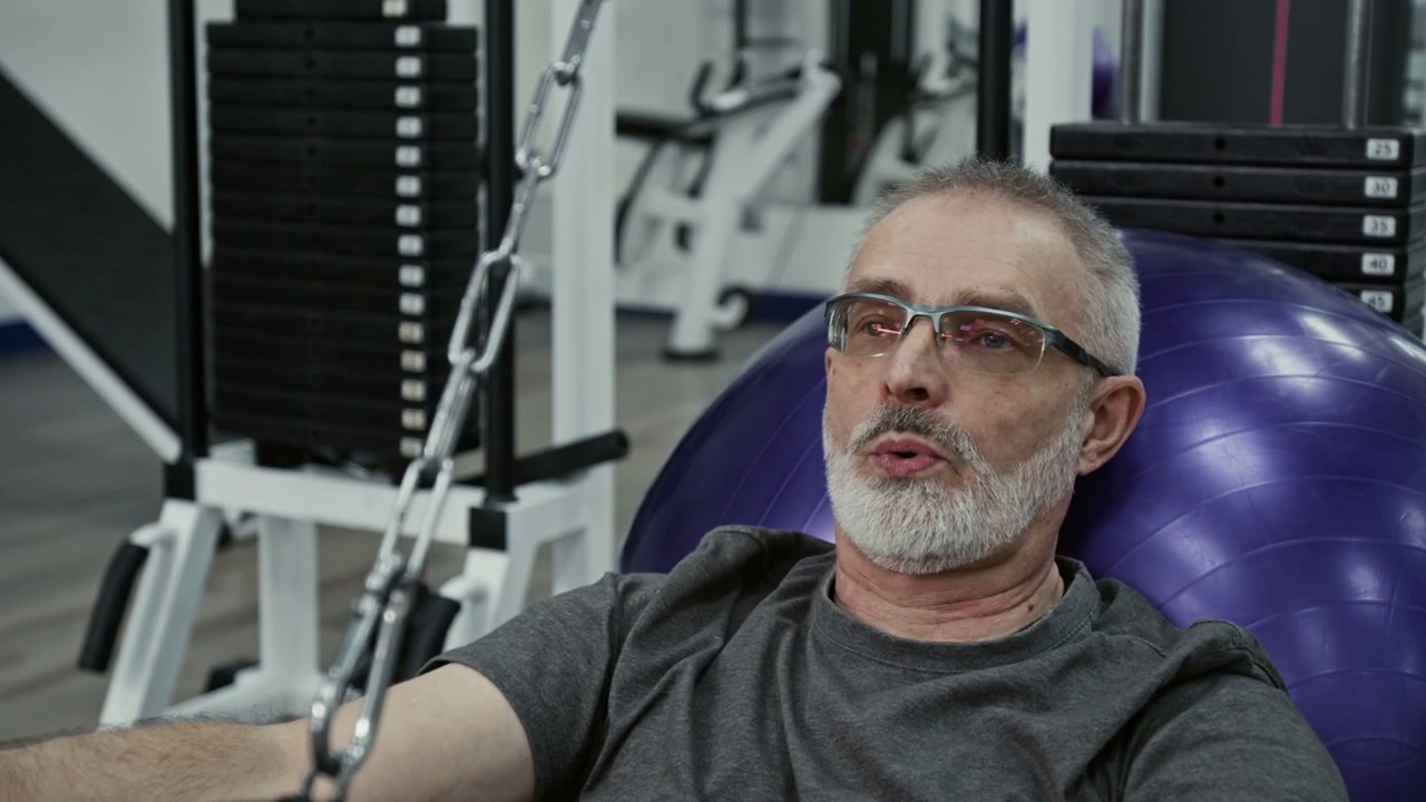 Mature Man Doing Rehabilitation Exercise