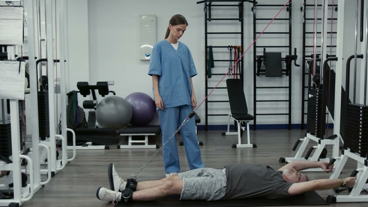 Senior Man Doing Leg Raises in Rehabilitation