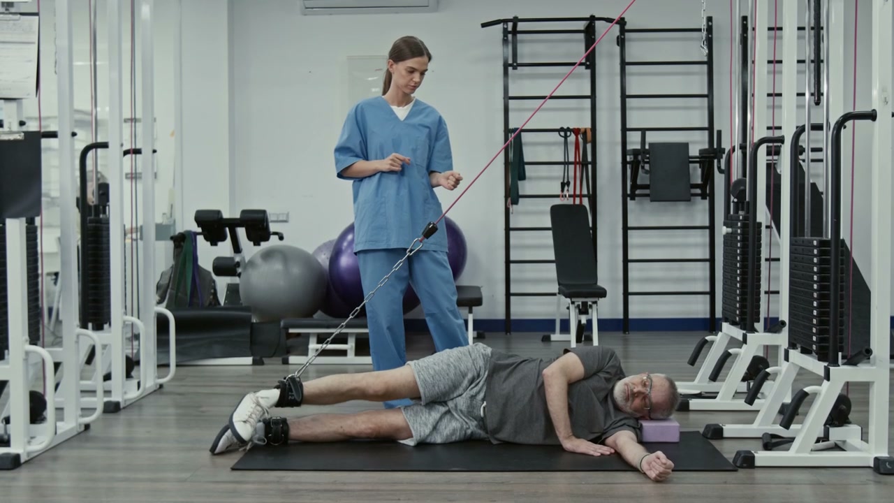 Elderly Man Doing Leg Raises in Rehabilitation