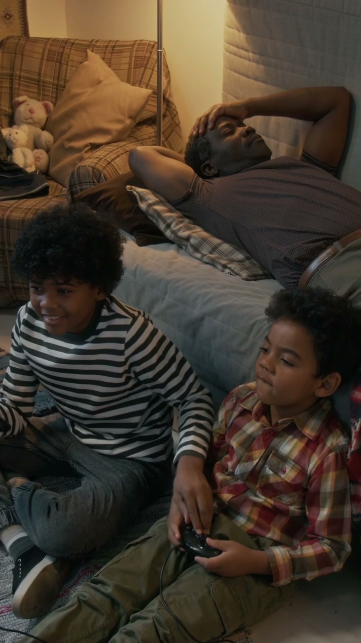 Boys Play Video Games, Father Stressed at Home