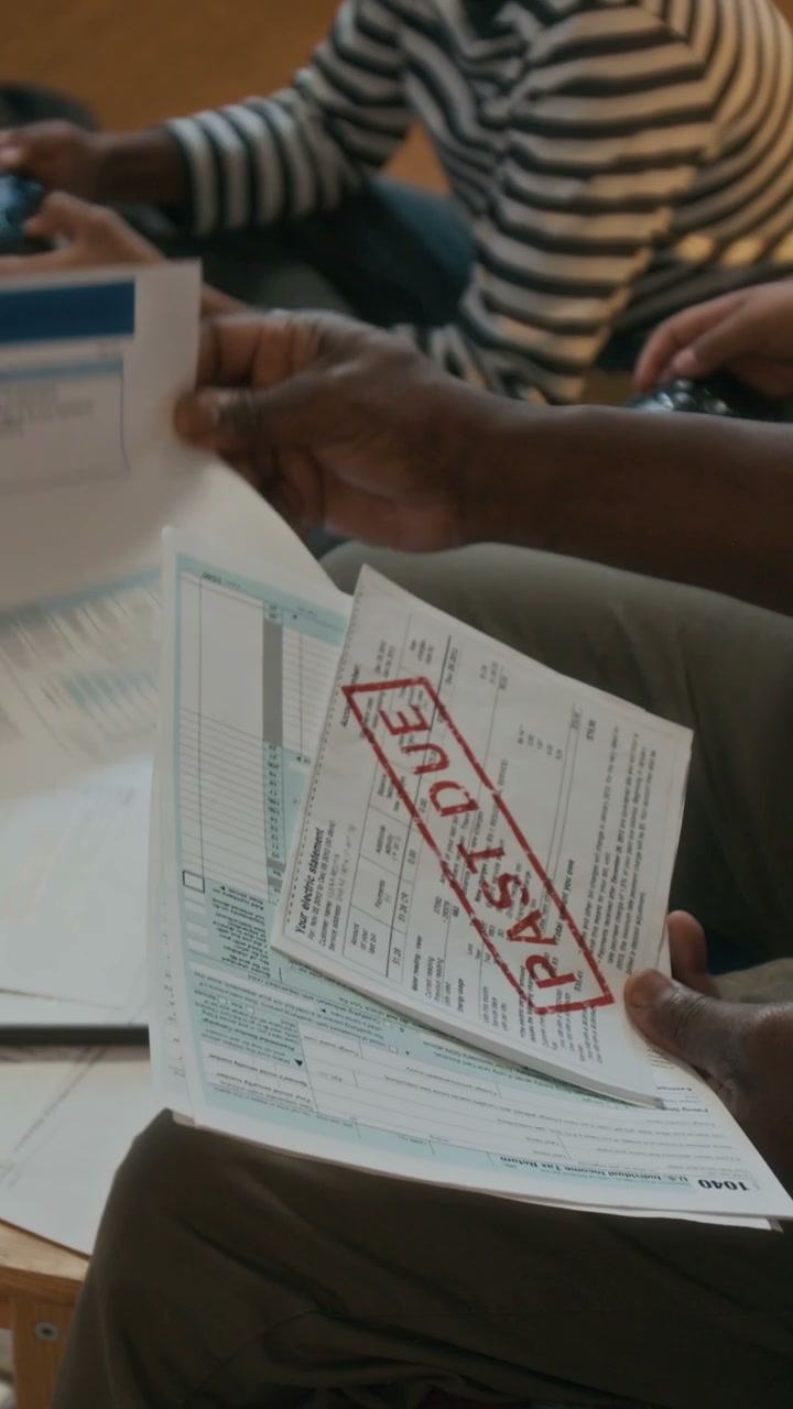 Person Sorting Past Due Bills