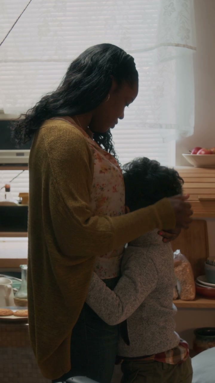 Mother and Son Embrace at Home