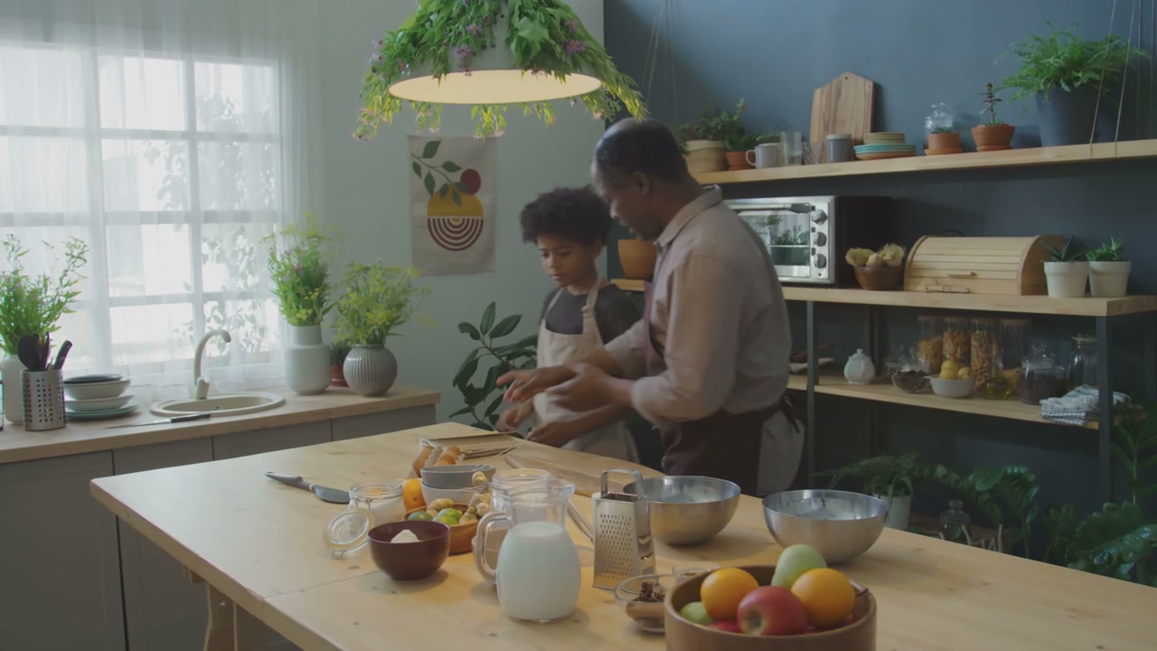 Grandfather and Grandson Read Recipe Book